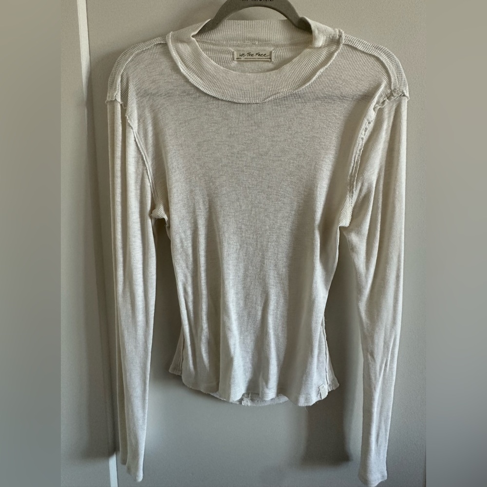 Free people NWOT, cream, long sleeve, shirt with open back. Size large.